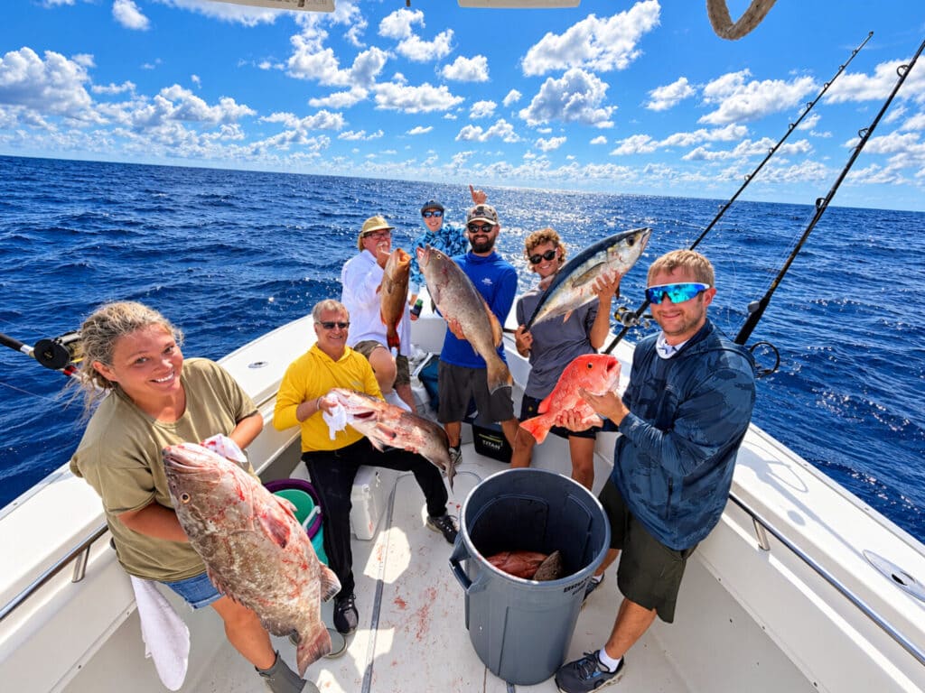 Group of anglers showing their catch on a charter boat